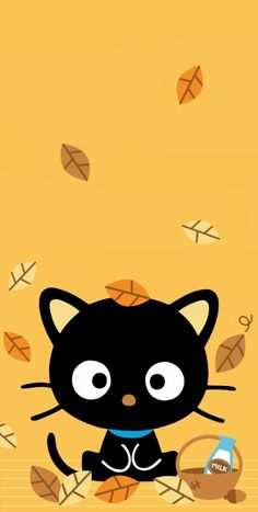 a black cat sitting on top of a pile of leaves next to an orange wall