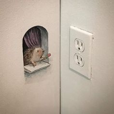 an illustration of a hedge sitting on top of a book in a hole between two outlets