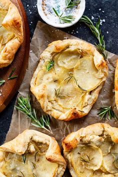 baked potato pies with rosemary sprigs on top