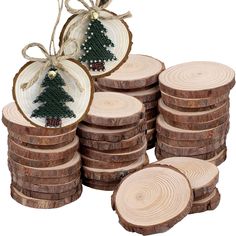 a stack of wooden slices with a christmas tree ornament