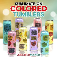 there are many cans of colored tumblers on the table with an advertisement in the background