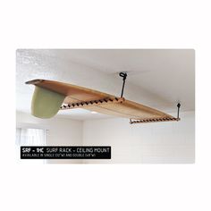 a surfboard hanging from the ceiling in a room