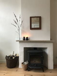 a living room with a fire place next to a basket