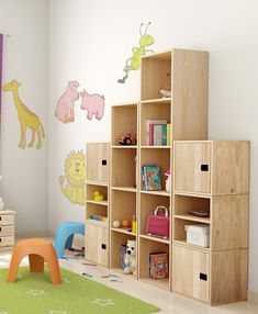 a child's room with bookshelves and toys