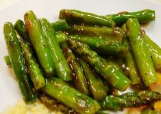 asparagus and mashed potatoes on a white plate