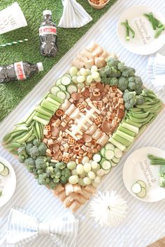 a platter with broccoli, cauliflower and other vegetables on it