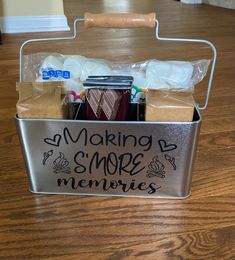 a metal container filled with lots of items on top of a wooden floor