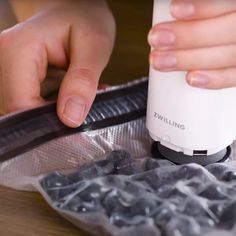 a person is using an electric device on top of plastic