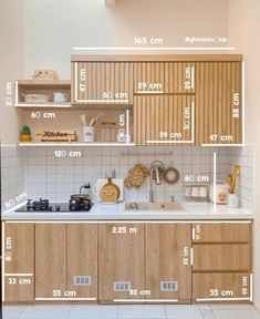 a kitchen area with measurements for the cabinets and counter tops, as well as other items