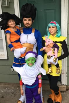 three people in costumes standing next to each other