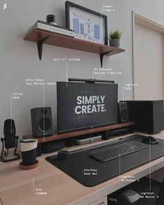 a desk with a computer monitor, keyboard and speakers on it that are labeled in the words simply create