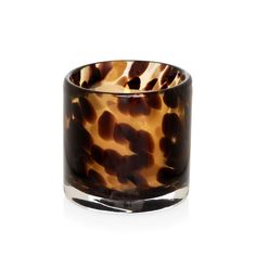 an animal print glass candle holder on a white background