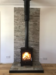 a wood burning stove sitting inside of a living room