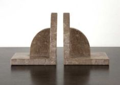 two marble bookends sitting on top of a wooden table