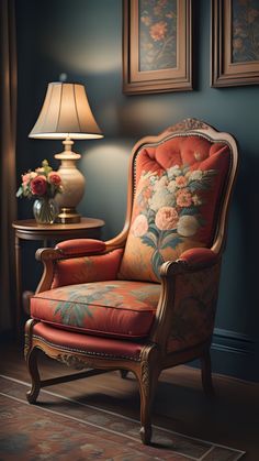 an ornate chair with floral upholstered fabric in front of two framed pictures on the wall