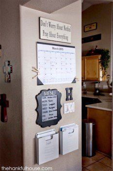 a refrigerator with magnets on it and a calendar attached to the side of it