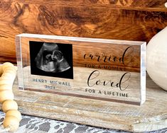 an acrylic plaque with the words, married for a life - time and a photo of a baby's boot