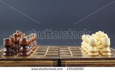 two pieces of chess on a wooden board