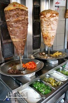 the buffet is full of many different types of food and dishes to choose from, including meats