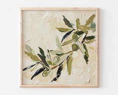 an abstract painting with green leaves in a wooden frame