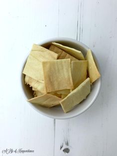 a white bowl filled with cut up pieces of food