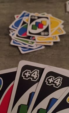 four unopened cards sitting on the floor next to each other with numbers in them