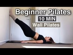 a woman in black shirt and leggings doing a yoga pose