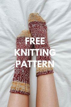 a pair of knitted mittens sitting on top of a white bed with the words free knitting pattern