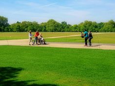 some people are walking around in the park