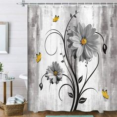 the shower curtain is decorated with flowers and butterflies on white wood planks, along with a blue rug