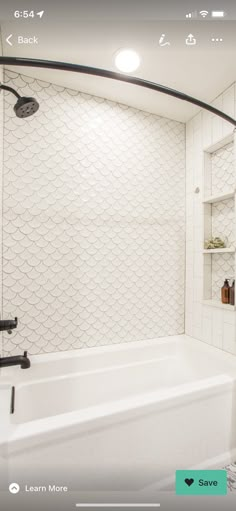 the bathroom is clean and ready to be used as a bathtub with shelves on either side