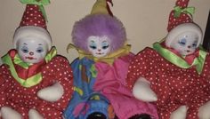 three clown dolls sitting next to each other