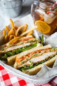 a basket filled with sandwiches and french fries