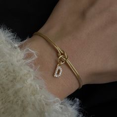 CUSTOM INITIAL LOVE KNOT BRACELET Material: 18 carat gold plated high quality solid 925 Sterling Silver Color options: Silver, gold and rose gold. Bracelet length is different for men and women. 6" (15+5 cm) with 2" extension for women 7" (18+5 cm) with 2" extension for men All bracelets come with a 2" extension chain so you can adjust it to your wrist. **HOW TO CARE FOR YOUR JEWELRY *Maintain your jewelry's high shine by avoiding contact with any chemicals such as soap, perfume, lotion, makeup, Elegant Metal Name Bracelet For Mother's Day, Tarnish Resistant Charm Bracelet For Anniversary, Classic Gold Plated Charm Bracelet Gift, Personalized Gold-tone Bracelets As A Gift, Luxury Name Bracelet For Gift, Elegant Silver Gold-plated Name Bracelet, Anniversary Silver Gold-plated Chain Bracelet, Classic Gold Bracelets For Valentine's Day, Gold Bracelets Valentine's Day Gift For Her