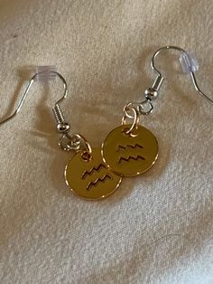 Aquarius zodiac earrings  1 in stock Earrings sold separately  Made by McKenna Capricorn Earrings, Aquarius Earrings, Drop Earrings Pisces, Gold Aquarius Necklace, Zodiac Earrings, Aquarius Necklace, Aquarius Zodiac, Charm Necklaces, Cute Earrings