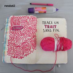 an open book with yarn and crochet on it