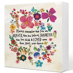 a white box with flowers on it and a quote from the book always remember that you are braver than you believe smarter