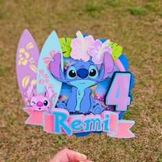 Stitch cake topper stich theme cake topper personalized stich cake topper girl birthday decor Lilo and Stitch tropical decor Hawaiian theme. Make your special day extra special with this beautiful & personalized Cake Topper inspired by Stitch. This Cake topper takes 3 to 5 business days to be shipped. If you need it soon, please visit: RUSH MY ORDER https://www.etsy.com/listing/1663477775/rush-my-order?ref=listings_manager_grid Details. 3D Cake Topper with Shaker. Cake Topper measures 8"W x 7.5"H approx. (without stick) Attached to a clear stick. This cake topper is made with cardstock. Please remember that colors may look slightly different from the photo due to lighting. COPYRIGHT DISCLAIMER I do not claim ownership over the characters. Copyrights of the character images belong to their Lilo And Stitch Birthday Party, Stitch Cake Topper, 3d Cake Toppers, Party Topper, Character Images, Girl Birthday Decorations