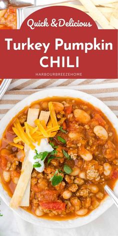 quick and delicious turkey pumpkin chili with cheese on top in a white bowl, garnished with parsley