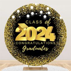 a class of graduation sign on top of a table