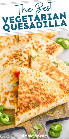 the best vegetarian quesadilla recipe with peppers and jalapenos on a cutting board