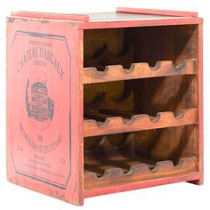 an old fashioned wooden wine rack with many bottles in it's storage compartment,