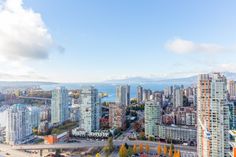 an aerial view of a city with tall buildings