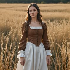 Give in to the magnificence of times gone by in this exquisite brown and cream medieval dress with its square neckline, long sleeves with gathered cuffs, exuding classic elegance. Perfect for historical events, reenactments, or themed gatherings, style and authenticity come together in this dress. Constructed from very lightweight and breathable fabric to ensure you are both looking and feeling your finest while stepping back in time. I hope you will enjoy my designs as much as I did when I was Woodland Nymph Costume, Old Style Dresses, 1800s Fashion Poor, Ren Fair Dress, Medieval Inspired Fashion, Medival Outfits Woman, Long Sleeve Brown Dress, Midevil Dress, Medieval Dress Peasant