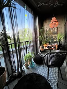 the balcony is decorated with plants and potted plants