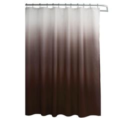 a brown and white shower curtain hanging on a metal rod