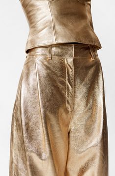 Sparkle meets swagger in wide-legged leather pants presented in a gleaming golden finish. Zip fly with hook-and-bar closure Side-seam pockets Lined Leather Professional leather clean Imported Gold Pants, Waistcoat Dress, Tshirt Skirt, Leather Trousers, Hair Accessories Jewelry, Denim Coat, Fashion Story, Dress Trousers, Shirt Skirt