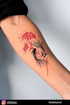 a woman's arm with a bird and flowers tattoo on the left inner arm