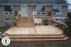 a large wooden deck in front of a house