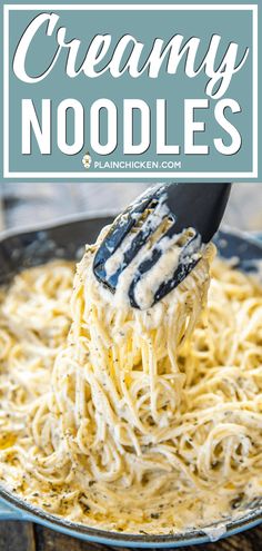 creamy noodles in a skillet being lifted with a spatula to eat the noodles